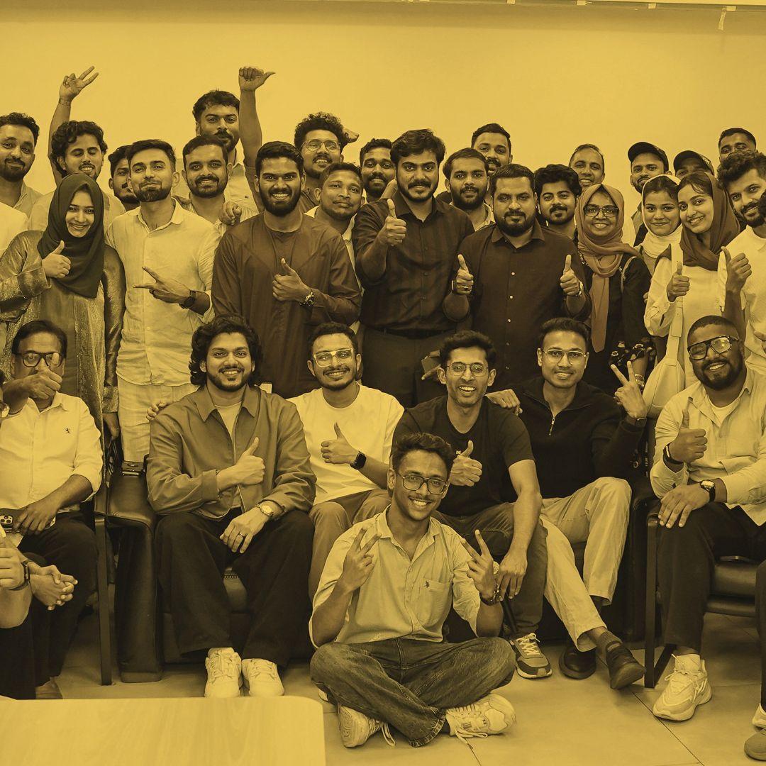 eCom Mafia members giving a thumbs up at a meetup